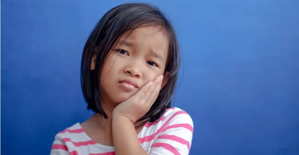 Toothache in Children hero - Kid Grins is Who You Need